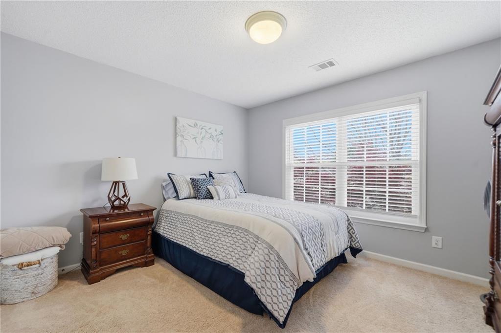 2135 Sugar Maple Lane Northwest Acworth, GA 30101 - Photo 29 of 59 a bedroom with a bed and a window
