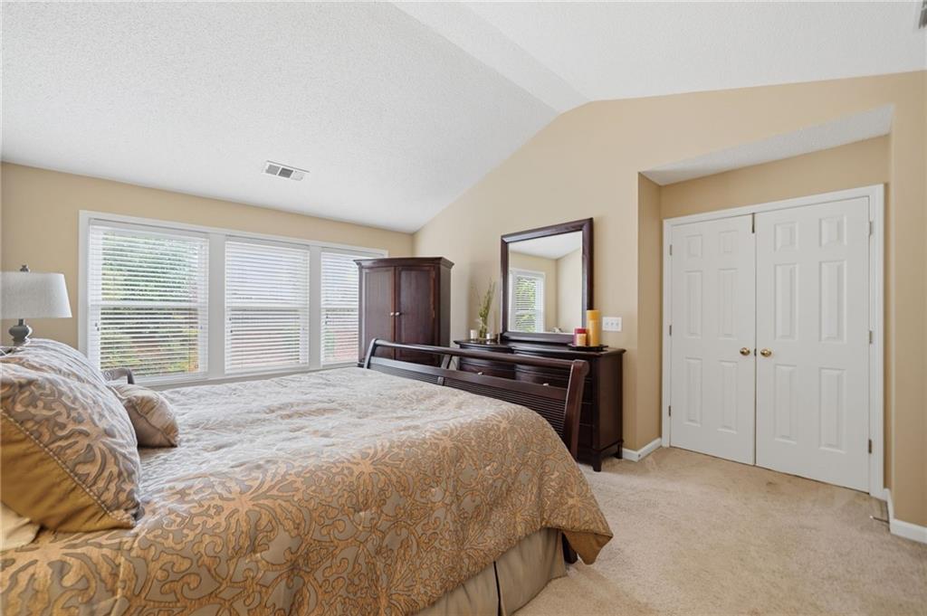 2135 Sugar Maple Lane Northwest Acworth, GA 30101 - Photo 32 of 59 a bedroom with a bed and wooden floor