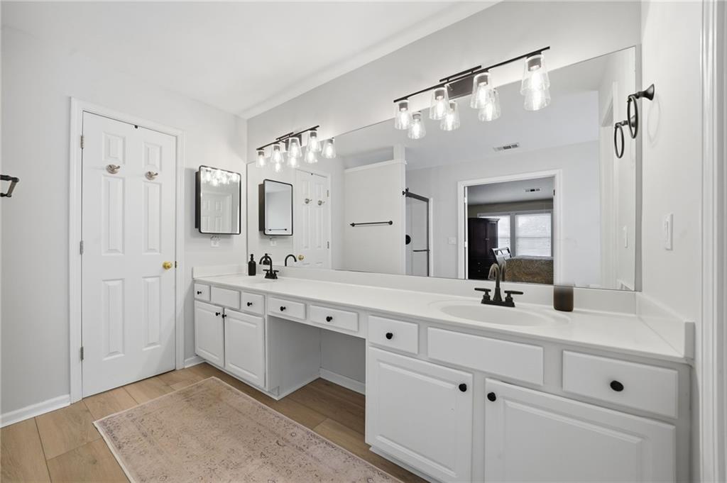 2135 Sugar Maple Lane Northwest Acworth, GA 30101 - Photo 35 of 59 a spacious bathroom with a double vanity sink mirror and double