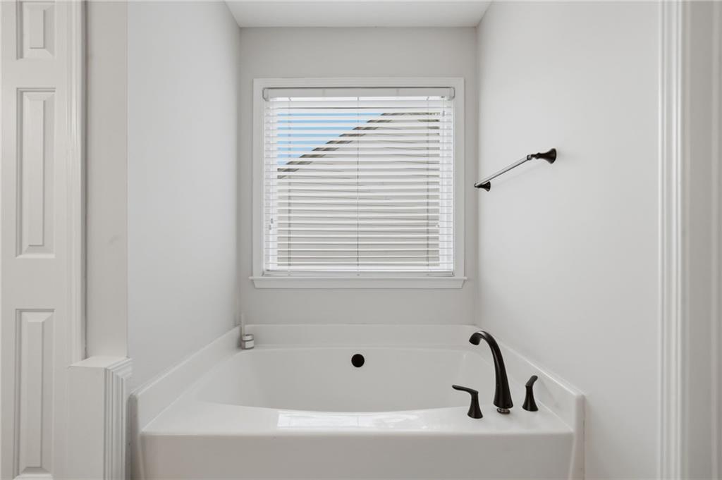 2135 Sugar Maple Lane Northwest Acworth, GA 30101 - Photo 38 of 59 a bathroom with a bathtub