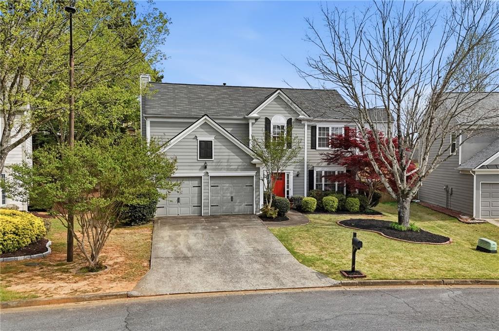 2135 Sugar Maple Lane Northwest Acworth, GA 30101 - Photo 4 of 59 a front view of a house with a yard