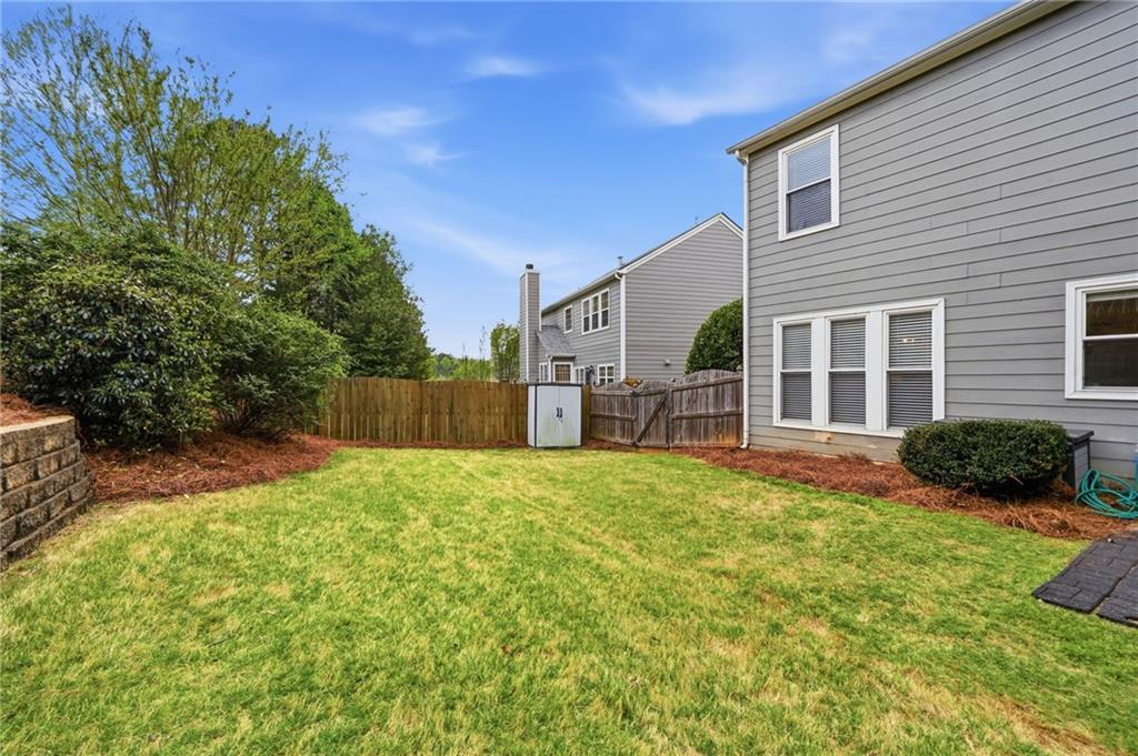 2135 Sugar Maple Lane Northwest Acworth, GA 30101 - Photo 42 of 59 a view of a house with backyard and sitting area