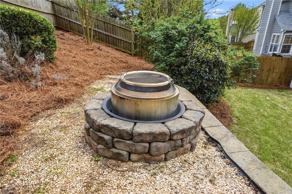 2135 Sugar Maple Lane Northwest Acworth, GA 30101 - Photo 48 of 59 a view of a backyard with table and chairs