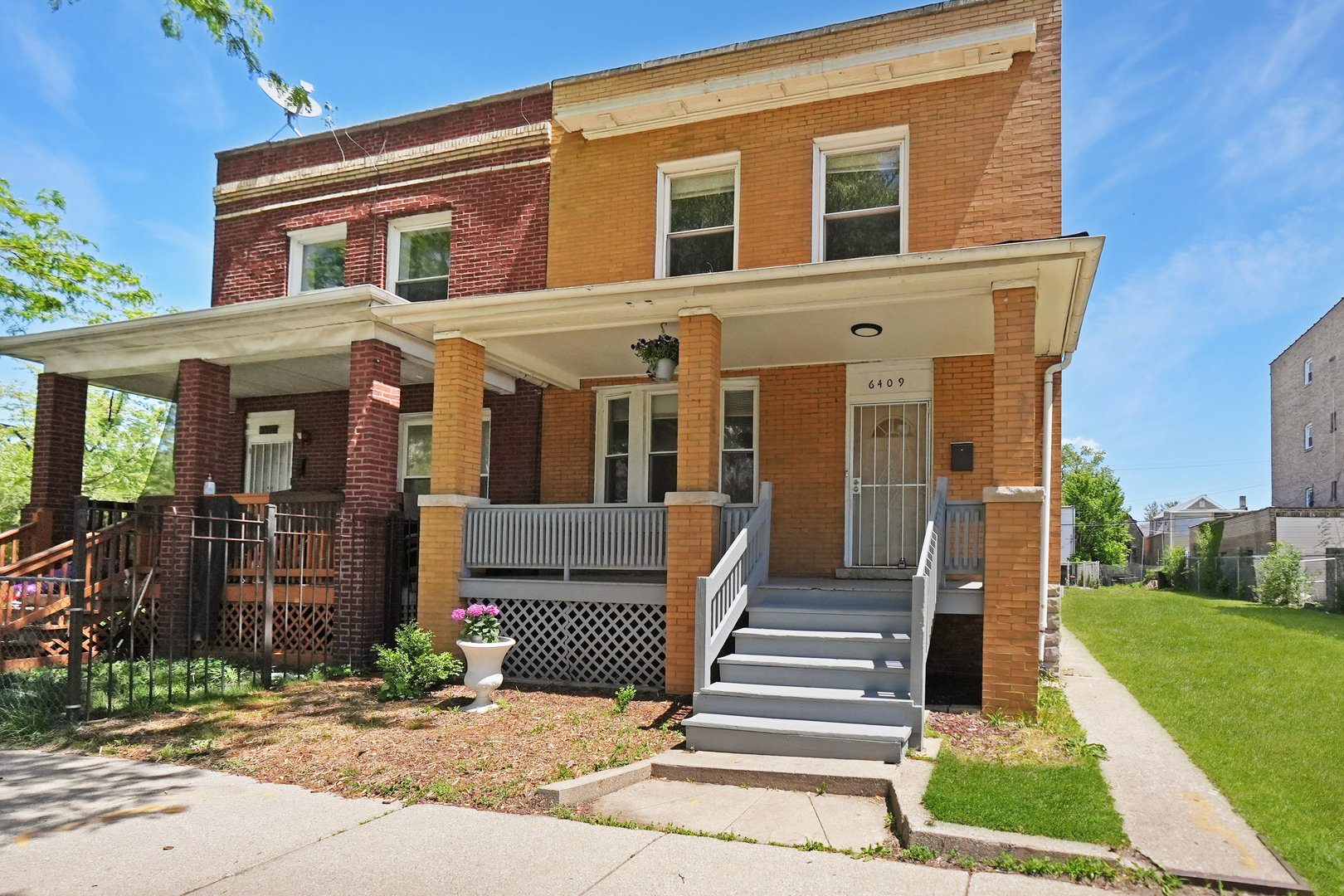 6409 South Champlain Avenue Chicago, IL 60637 - Photo 1 of 33 a front view of a house with garden