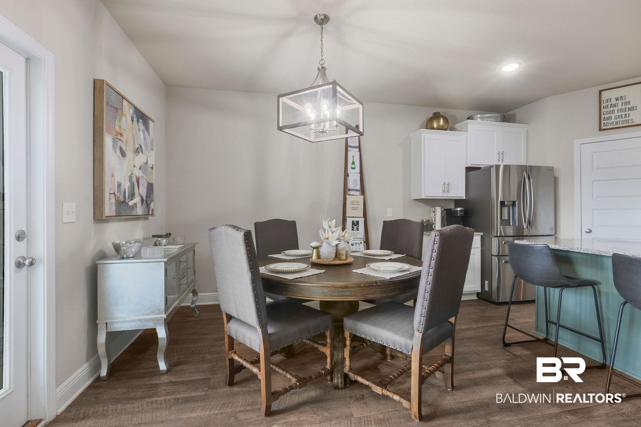9056 Impala Drive Foley, AL 36535 - Photo 8 of 22 Dining room featuring dark hardwood / wood-style floors and a chandelier
