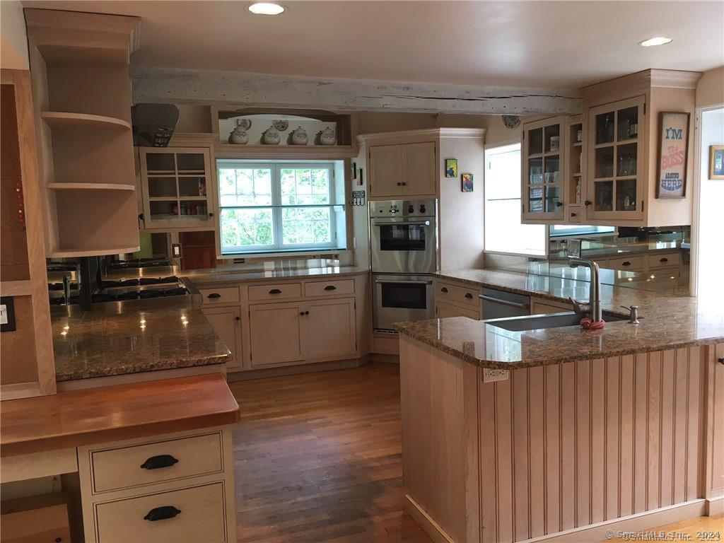 178 Ferris Hill Road New Canaan, CT 06840 - Photo 11 of 19 a kitchen with stainless steel appliances granite countertop a sink and a stove