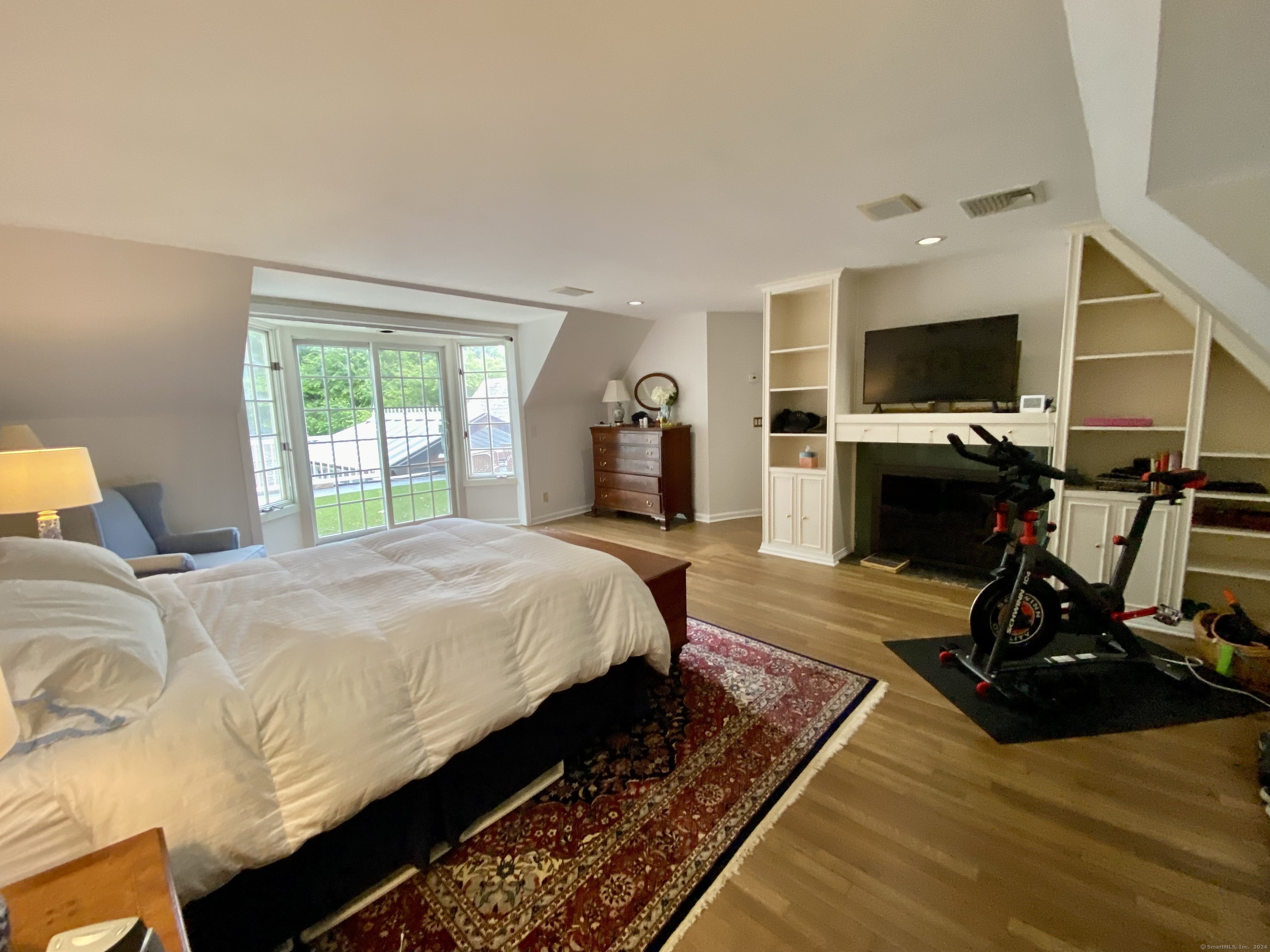 178 Ferris Hill Road New Canaan, CT 06840 - Photo 15 of 19 a bed room with a bed and a flat screen tv