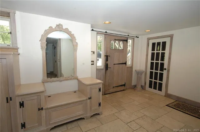 a view of a livingroom with furniture and windows