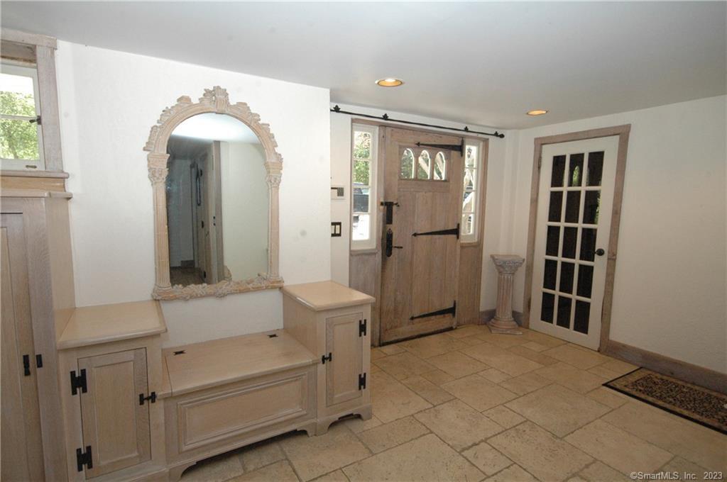 178 Ferris Hill Road New Canaan, CT 06840 - Photo 5 of 19 a view of a livingroom with furniture and windows