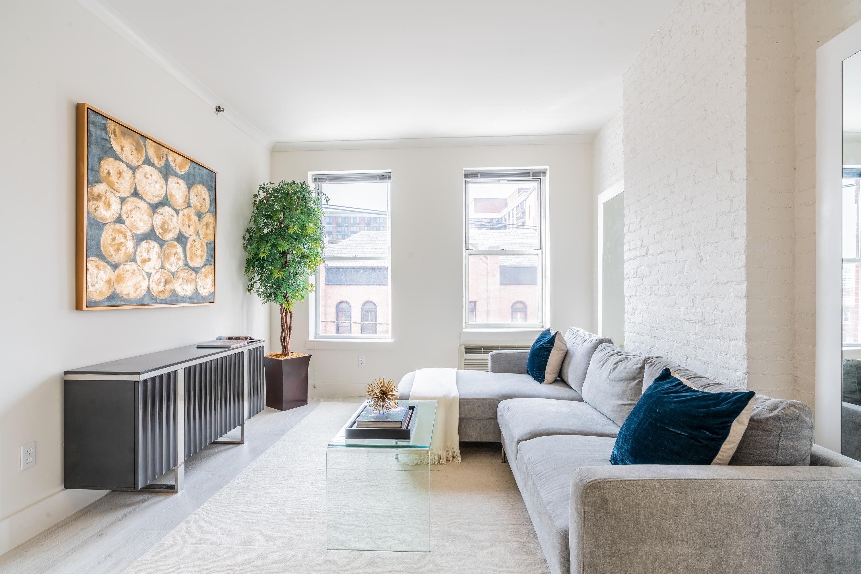 a living room with furniture and windows