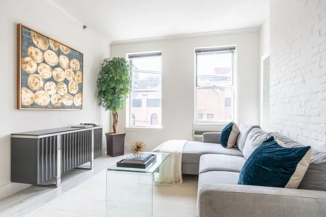 a living room with furniture and a window