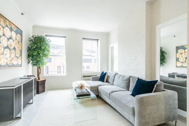 a living room with furniture and windows