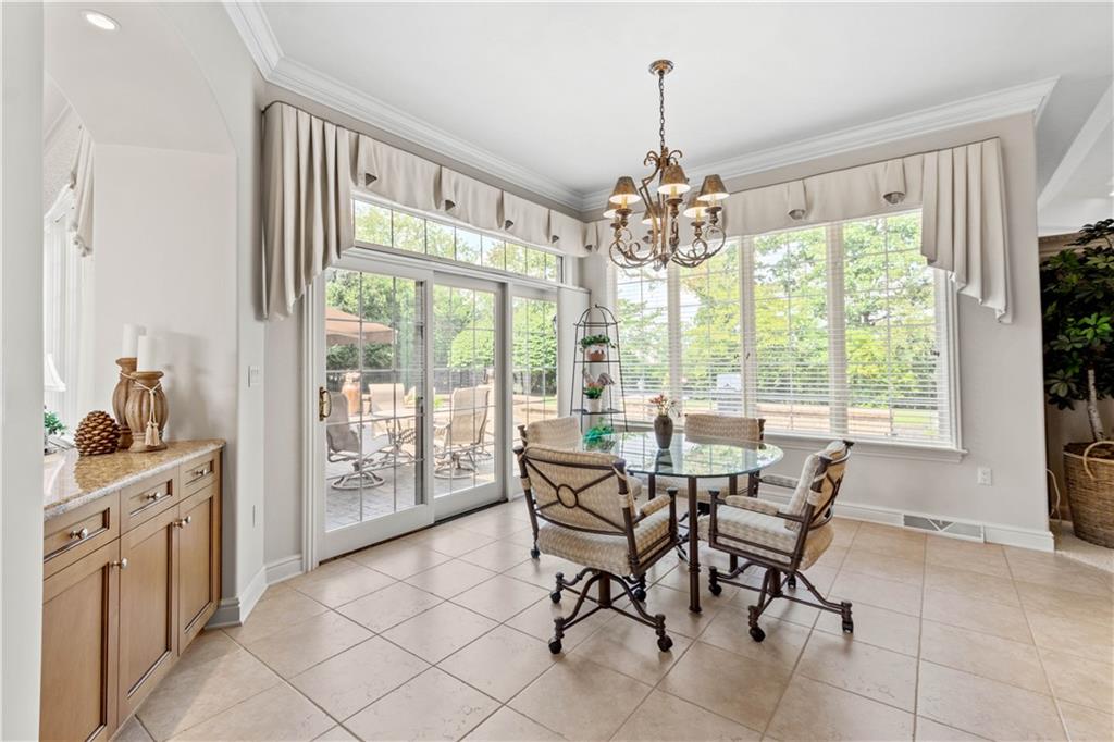 247 Whetherburn Drive Wexford, PA 15090 - Photo 11 of 25 a view of a dining room with furniture large windows and wooden floor