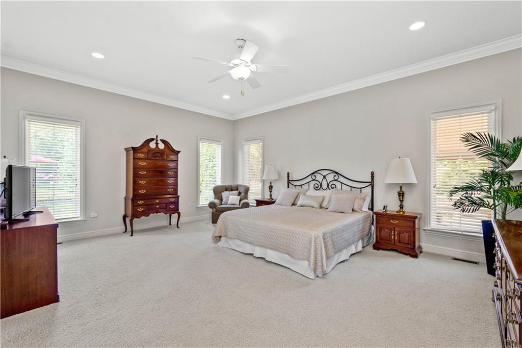 247 Whetherburn Drive Wexford, PA 15090 - Photo 13 of 25 a spacious bedroom with a bed and a chandelier