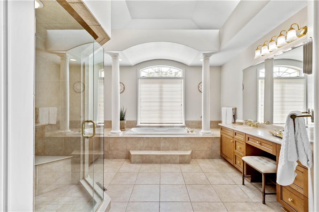 247 Whetherburn Drive Wexford, PA 15090 - Photo 14 of 25 a spacious bathroom with a mirror a bathtub and a shower