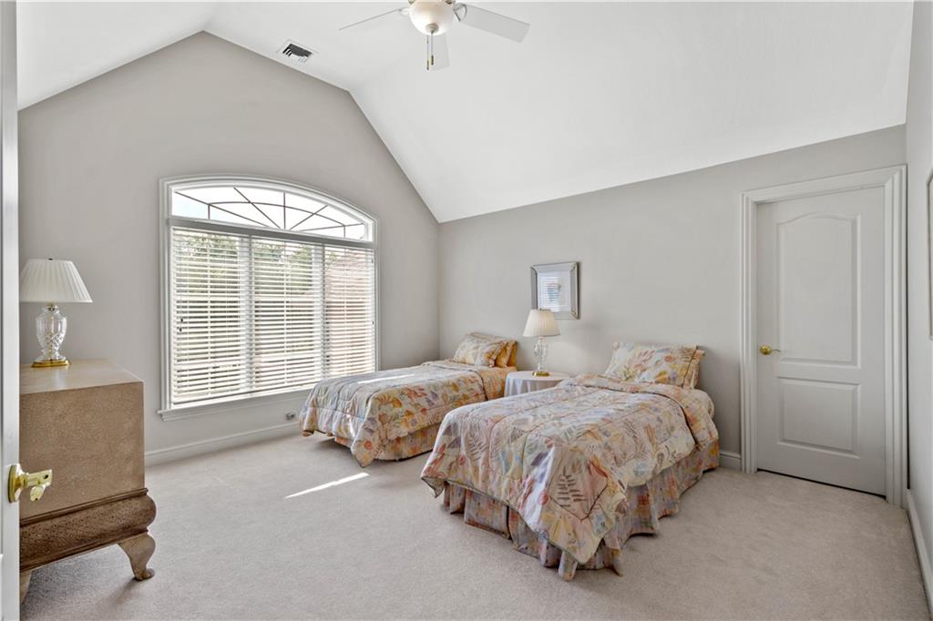 247 Whetherburn Drive Wexford, PA 15090 - Photo 16 of 25 a spacious bedroom with two beds and a chandelier