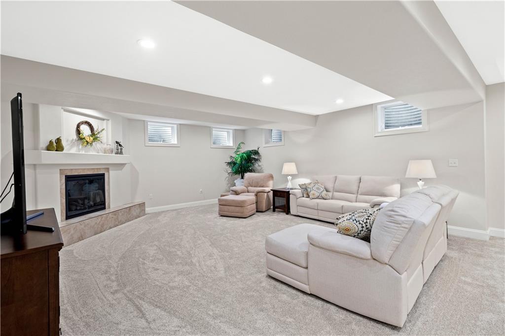 247 Whetherburn Drive Wexford, PA 15090 - Photo 19 of 25 a living room with furniture and a fireplace