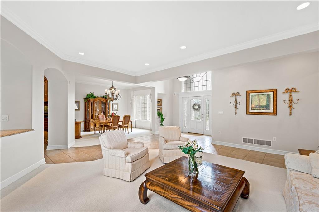 247 Whetherburn Drive Wexford, PA 15090 - Photo 3 of 25 a living room with furniture and a chandelier