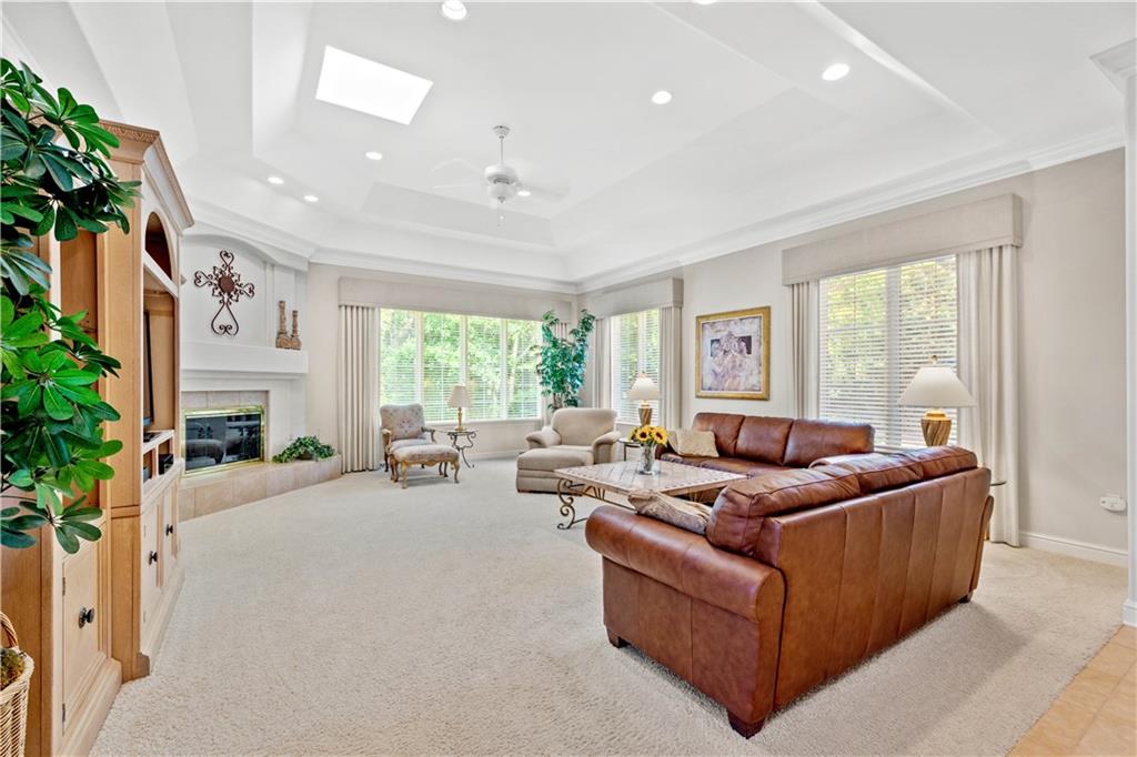 247 Whetherburn Drive Wexford, PA 15090 - Photo 6 of 25 a living room with furniture fireplace and large windows