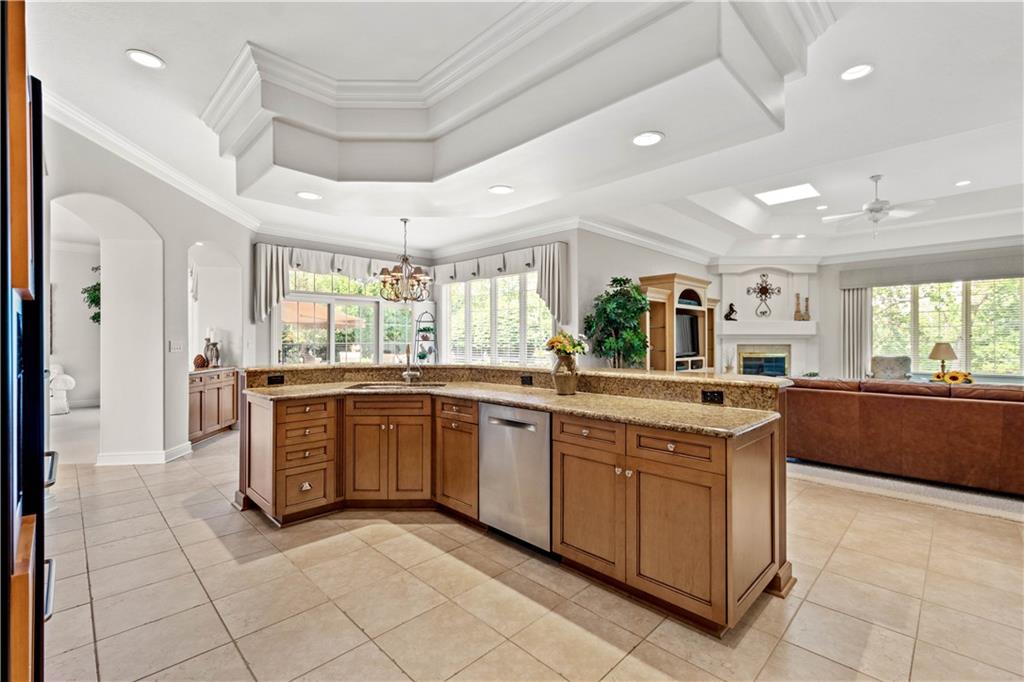 247 Whetherburn Drive Wexford, PA 15090 - Photo 10 of 25 a large kitchen with kitchen island granite countertop lots of counter space and windows