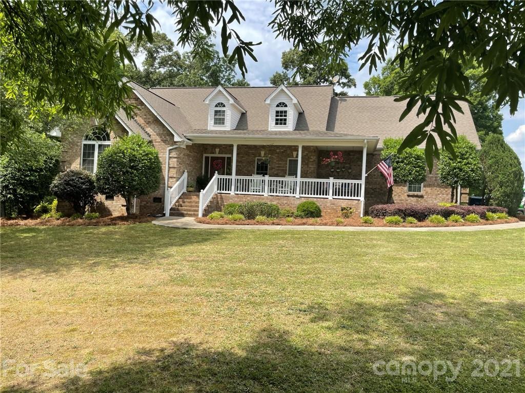 6023 Olive Branch Road Wingate, NC 28174 - Photo 2 of 44 a view of a house with a swimming pool