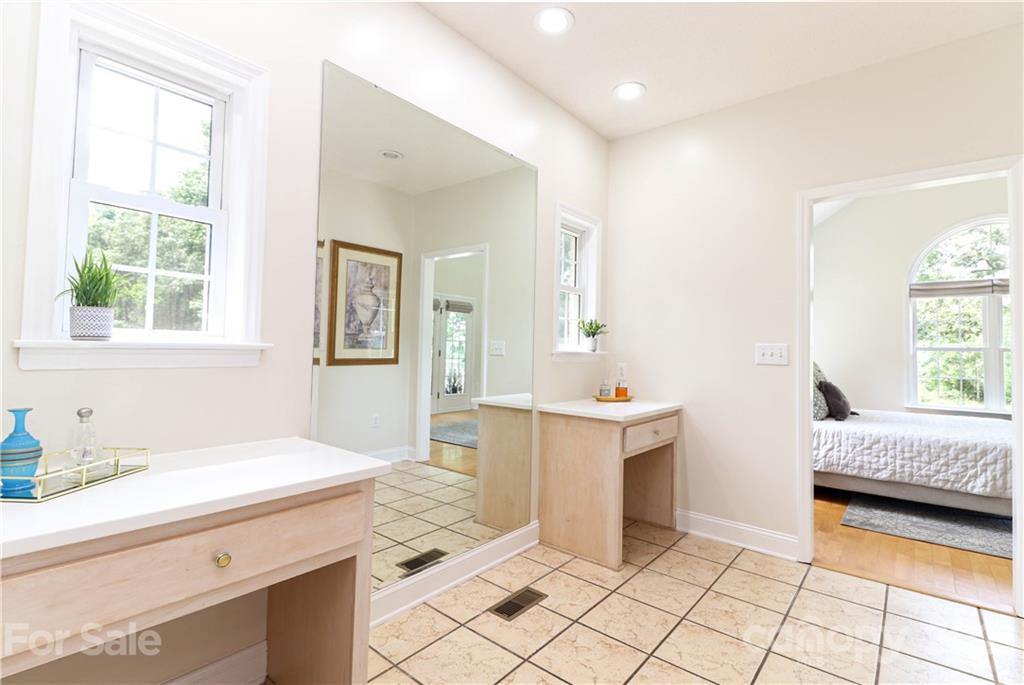 6023 Olive Branch Road Wingate, NC 28174 - Photo 13 of 44 a en suite bathroom with a double vanity sink mirror and