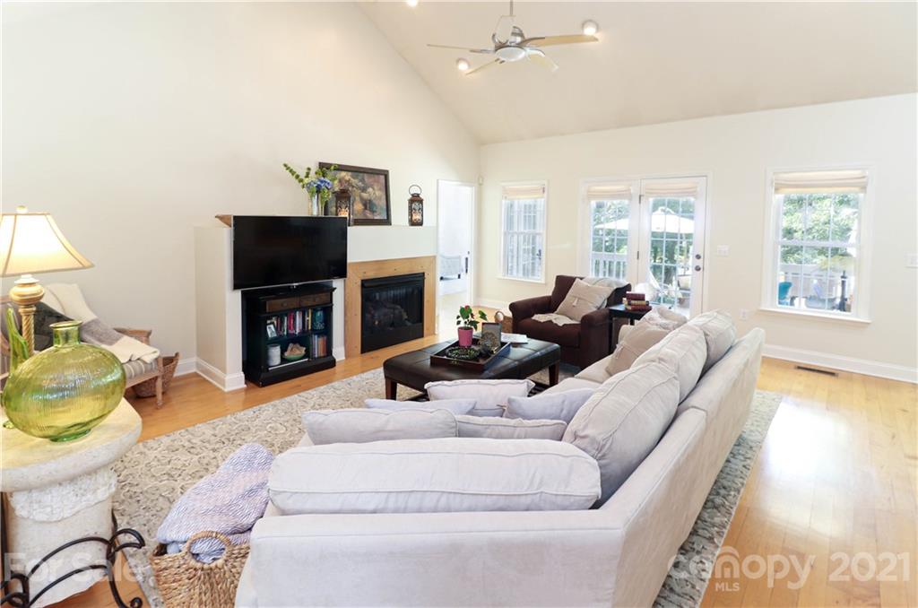 6023 Olive Branch Road Wingate, NC 28174 - Photo 26 of 44 a living room with furniture a flat screen tv and a fireplace