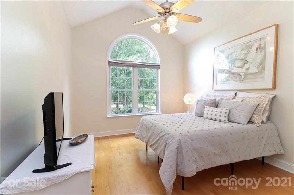 6023 Olive Branch Road Wingate, NC 28174 - Photo 27 of 44 a bedroom with a bed and a flat screen tv