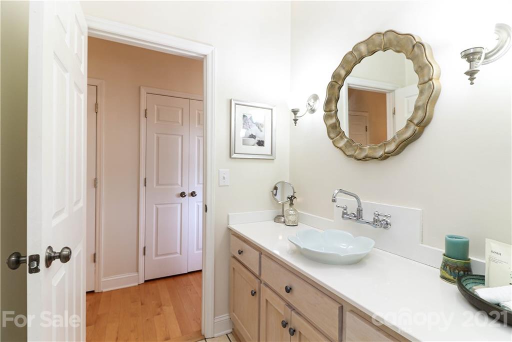 6023 Olive Branch Road Wingate, NC 28174 - Photo 30 of 44 a bathroom with a sink and a mirror