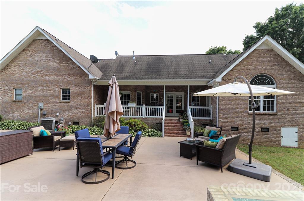 6023 Olive Branch Road Wingate, NC 28174 - Photo 4 of 44 a view of a house with a backyard and sitting area