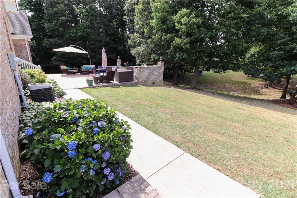 6023 Olive Branch Road Wingate, NC 28174 - Photo 6 of 44 a view of a backyard with sitting area