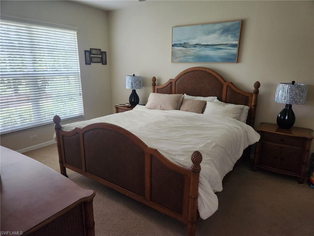 8085 Celeste Drive, Unit 812 Naples, FL 34113 - Photo 3 of 6 a bedroom with a bed and window