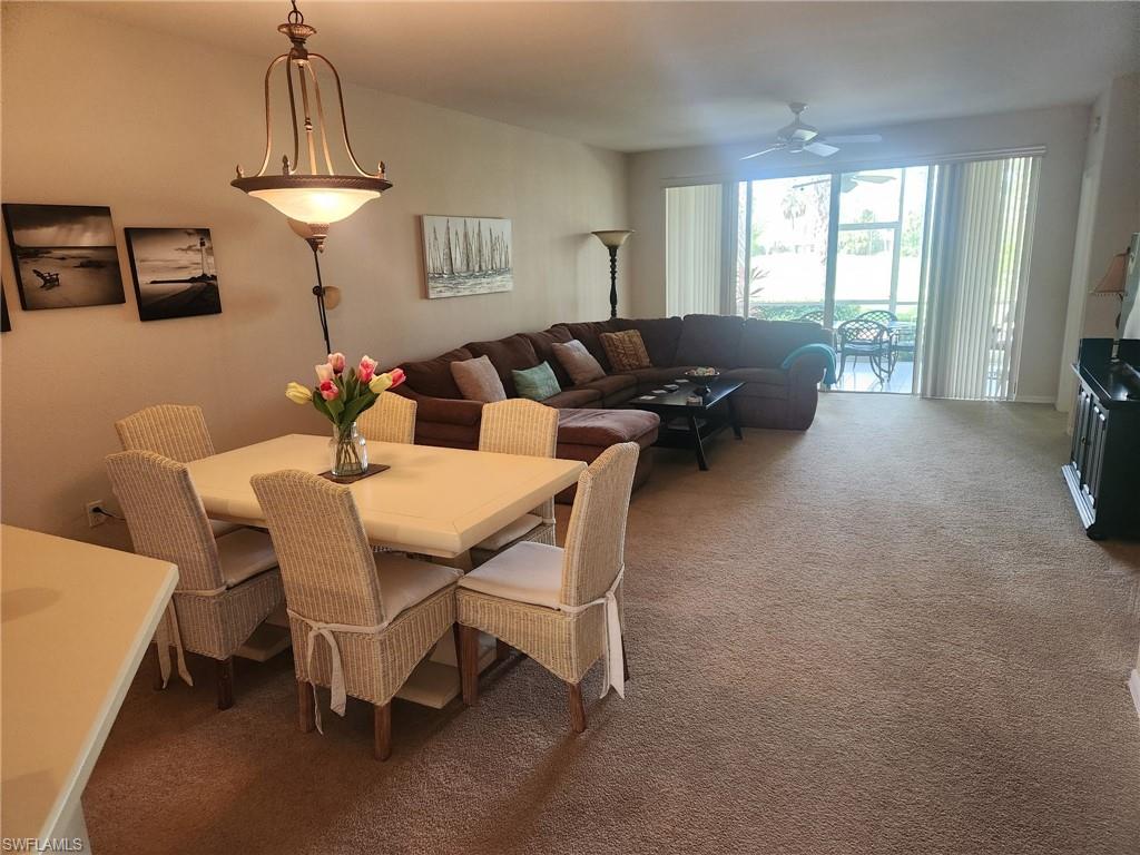 8085 Celeste Drive, Unit 812 Naples, FL 34113 - Photo 5 of 6 a dining room with furniture and window