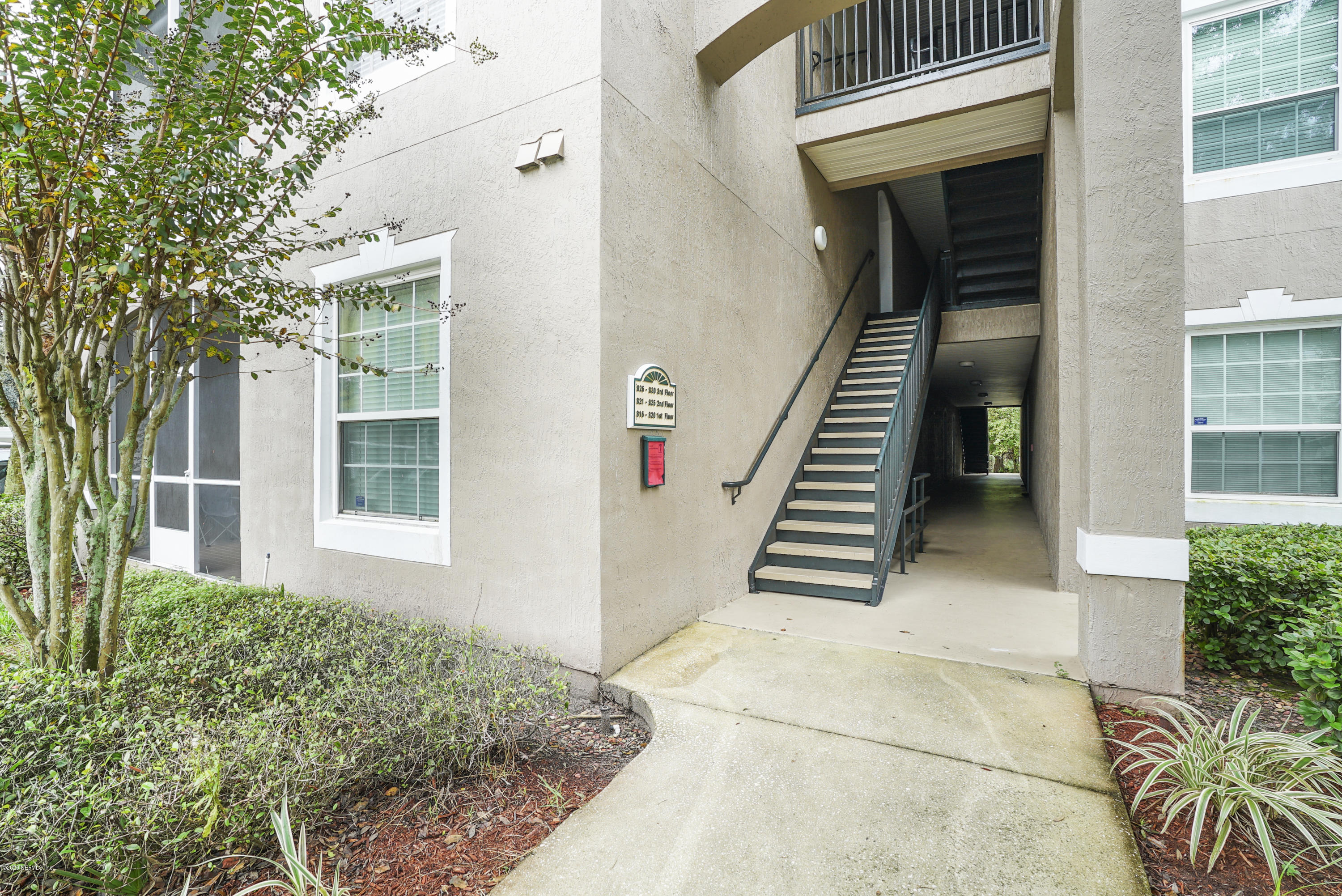 10550 Baymeadows Road, Unit 821 Jacksonville, FL 32256 - Photo 5 of 31 Up the stairs and Door on the left