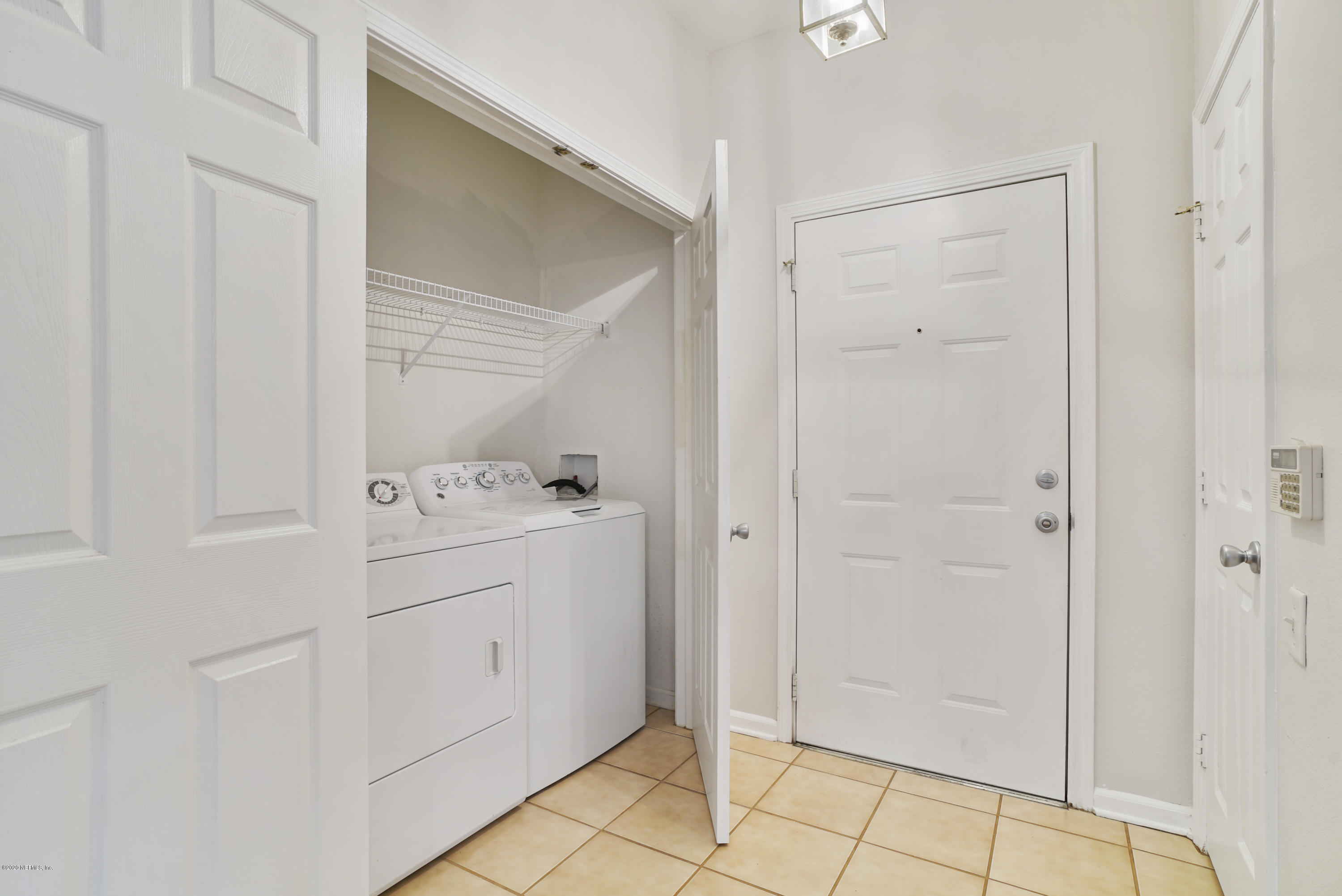 10550 Baymeadows Road, Unit 821 Jacksonville, FL 32256 - Photo 6 of 31 Tiled Foyer / Laundry hookup in Unit