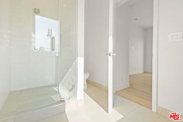 a bathroom with a tub and shower