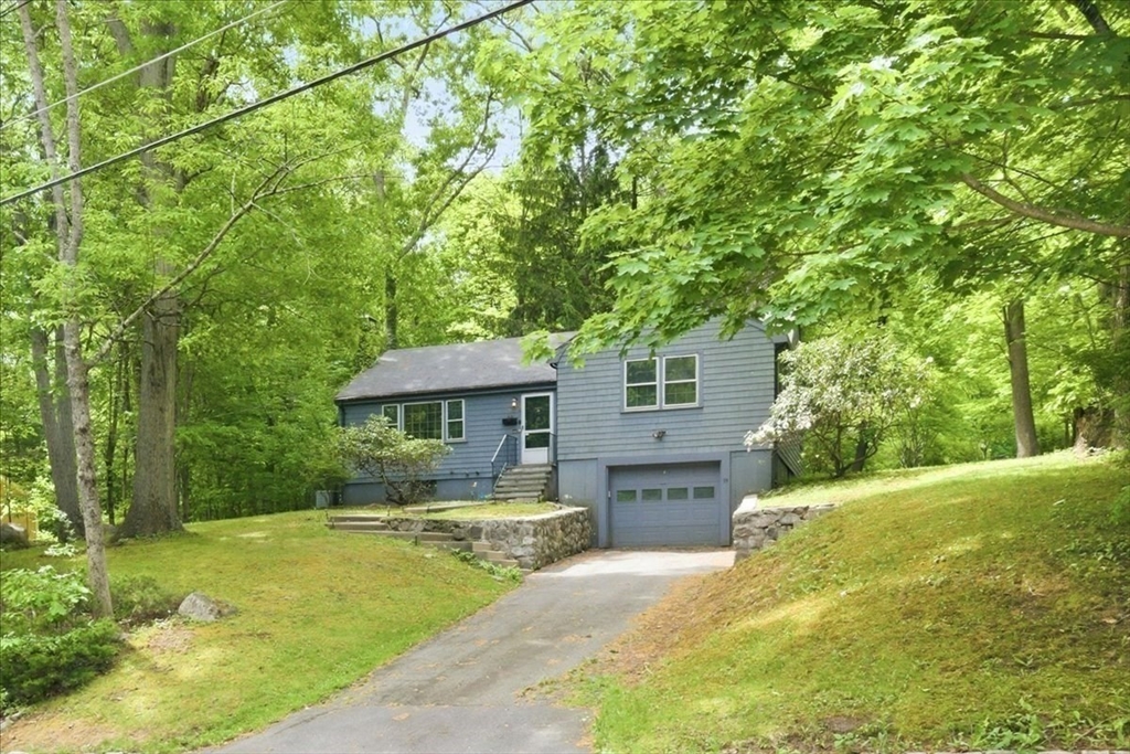 99 Brook Road Sharon, MA 02067 - Photo 34 of 37 a front view of a house with a yard