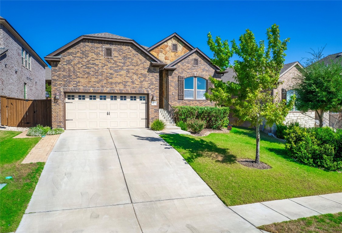 14916 Cabrillo Way Austin, TX 78738 - Photo 1 of 1 a front view of a house with a yard
