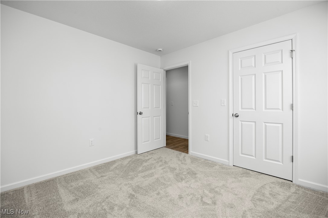 1999 East Oldgate Road Sandusky, OH 44870 - Photo 28 of 32 Unfurnished bedroom featuring baseboards and carpet flooring