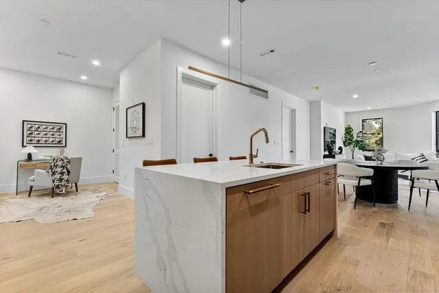 a kitchen with stainless steel appliances a sink and a stove