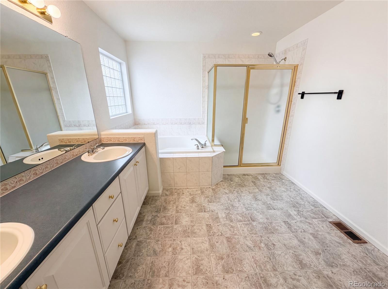 20000 Mitchell Place, Unit 45 Denver, CO 80249 - Photo 21 of 29 a bathroom with a double vanity sink mirror and double