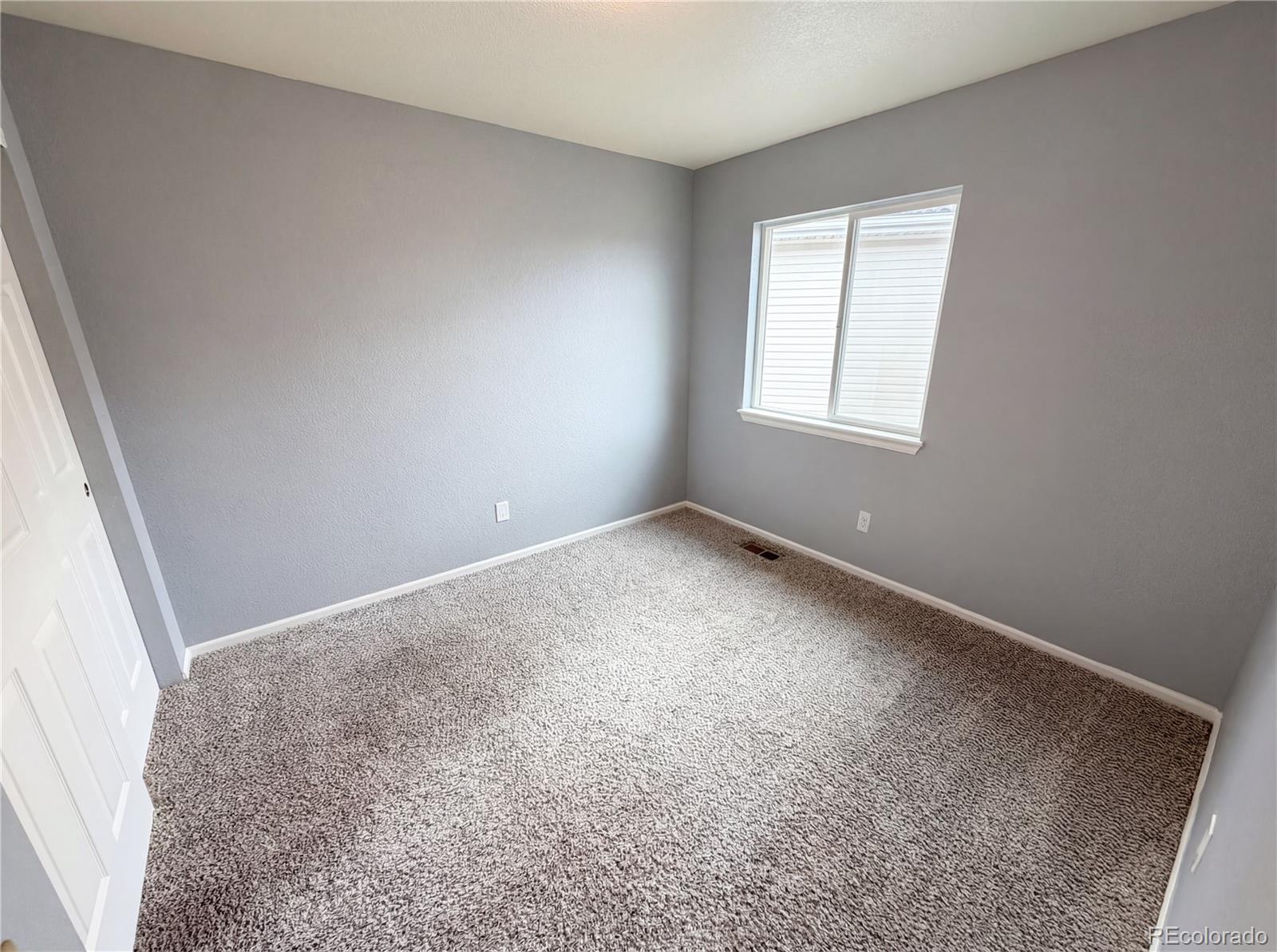 20000 Mitchell Place, Unit 45 Denver, CO 80249 - Photo 23 of 29 an empty room with windows