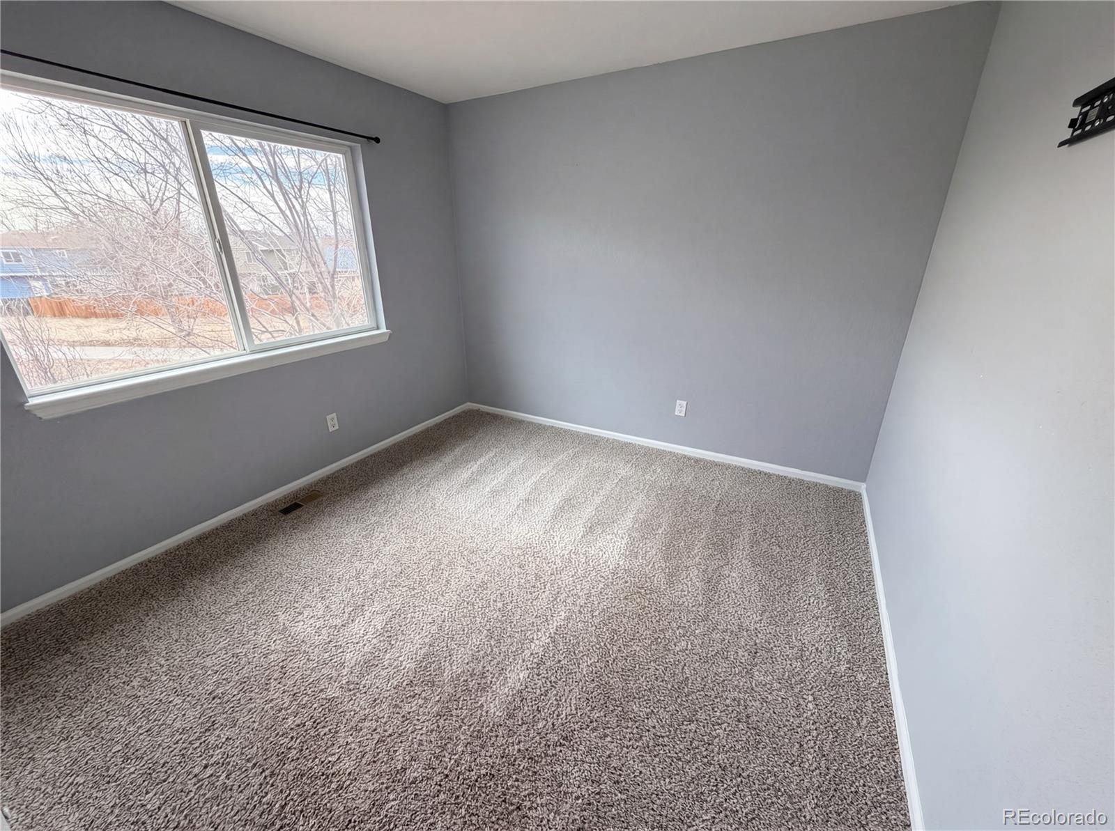 20000 Mitchell Place, Unit 45 Denver, CO 80249 - Photo 25 of 29 an empty room with a window