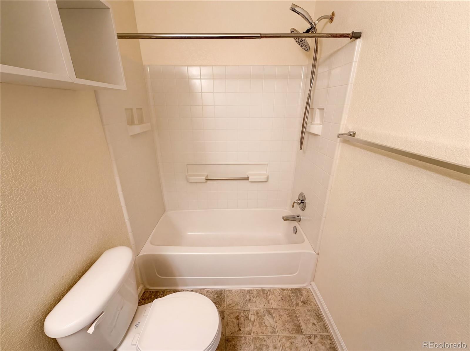 20000 Mitchell Place, Unit 45 Denver, CO 80249 - Photo 28 of 29 a bathroom with a toilet and shower