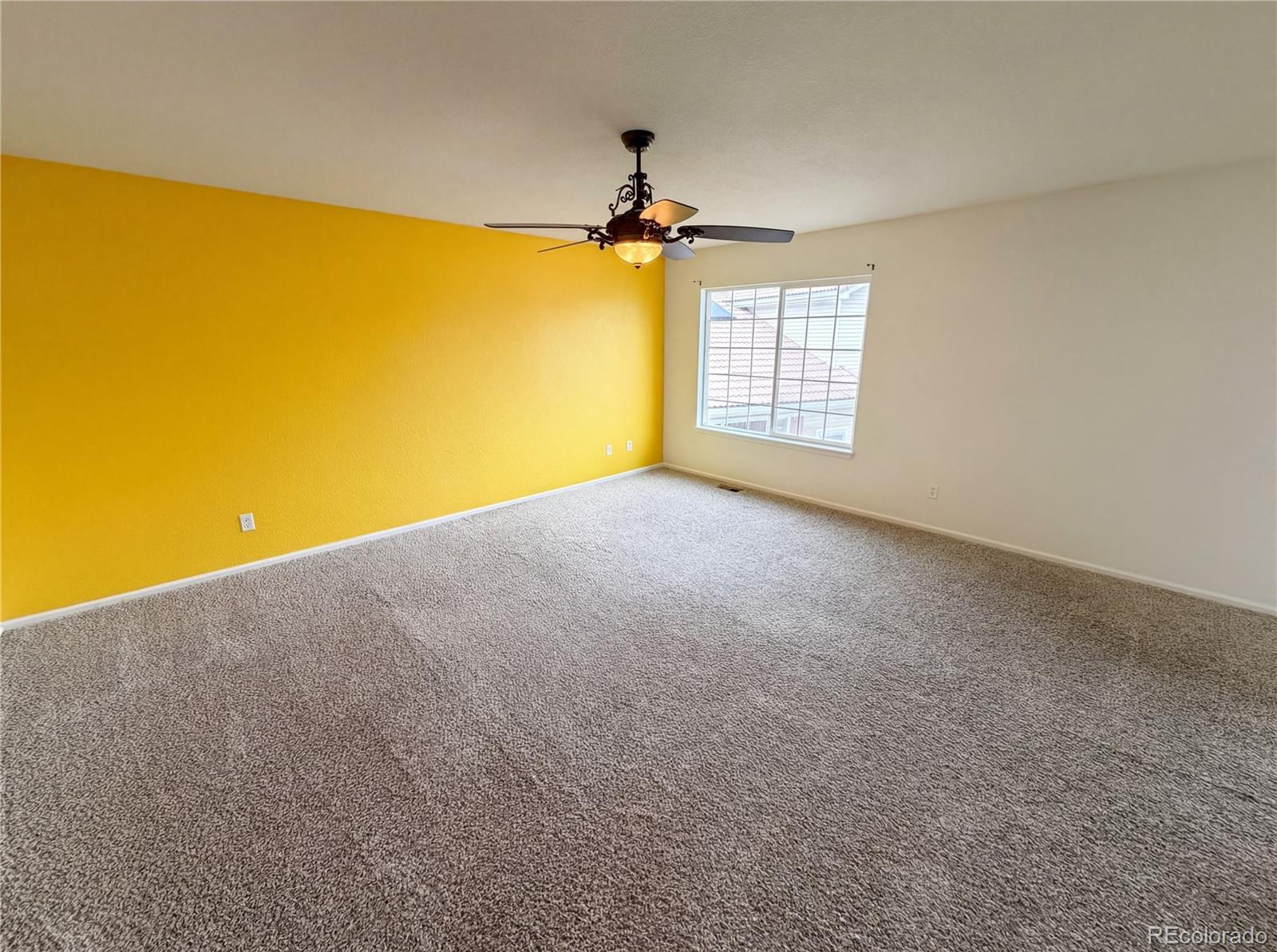 20000 Mitchell Place, Unit 45 Denver, CO 80249 - Photo 4 of 29 a view of empty room with a window