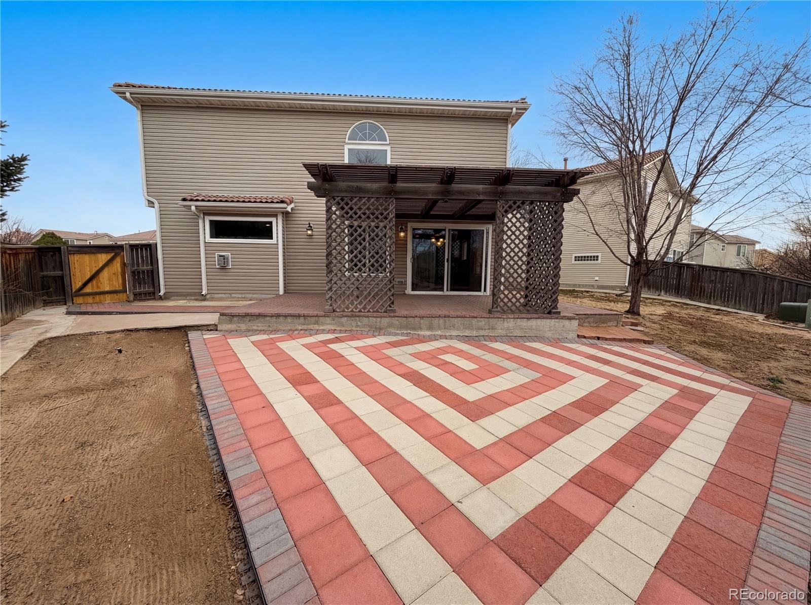 20000 Mitchell Place, Unit 45 Denver, CO 80249 - Photo 5 of 29 a front view of a house with a yard