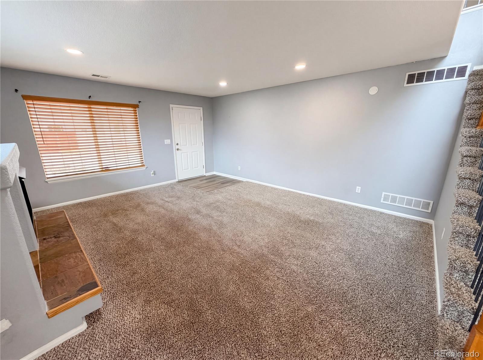 20000 Mitchell Place, Unit 45 Denver, CO 80249 - Photo 9 of 29 a view of an empty room with a window