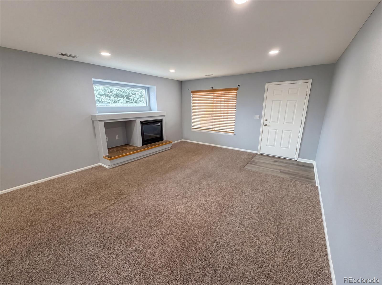 20000 Mitchell Place, Unit 45 Denver, CO 80249 - Photo 10 of 29 an empty room with windows