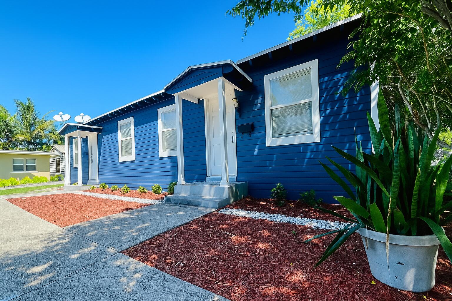 517 Kanuga Drive, Unit 1 West Palm Beach, FL 33401 - Photo 1 of 13 a front view of a house with a yard