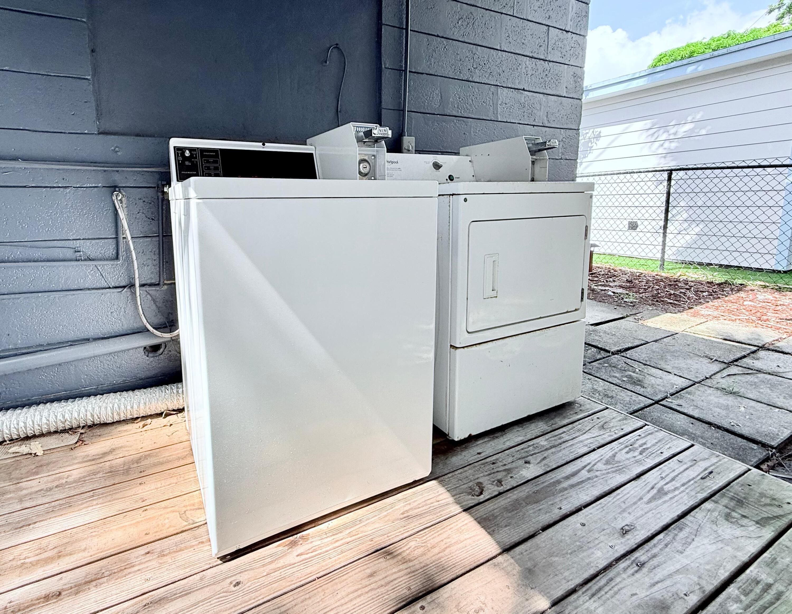 517 Kanuga Drive, Unit 1 West Palm Beach, FL 33401 - Photo 8 of 13 a utility room with dryer and washer